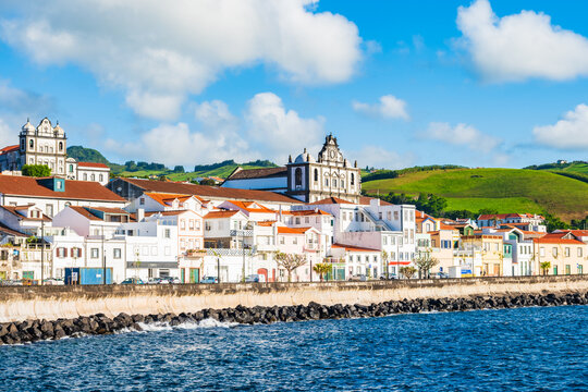 View of Horta port with town buildings and coastal promenade, Faial island, Azores, Portugal