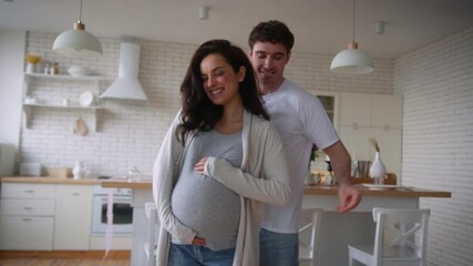 Happy funny active fooling having fun move listening music home party celebrate relocation pregnant couple dance pregnancy medical insurance health dancing man guy male father woman girl female mother - Powered by Adobe