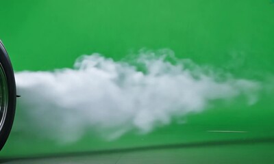 Tire burnout smoke isolated on green background 4K video