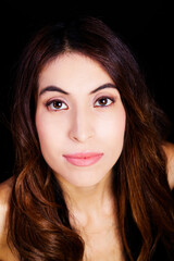 Obraz premium Bare Shoulder Portrait Hispanic Woman On Black Background