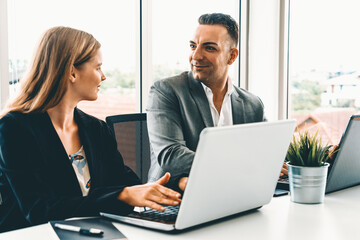 Obraz premium Businessman executive is in meeting discussion with a businesswoman worker in modern workplace office. People corporate business team concept. uds