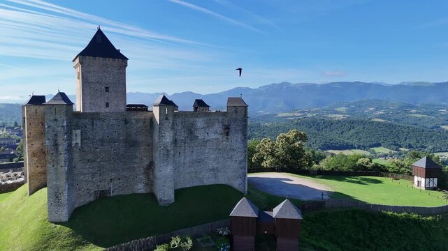 Aerial view of the medieval castle of Mauvezin and the Pyrenees mountains in France