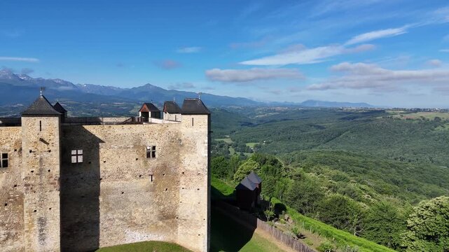 Aerial view of the medieval castle of Mauvezin and the Pyrenees mountains in France