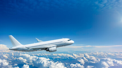 passenger plane flies among the clouds