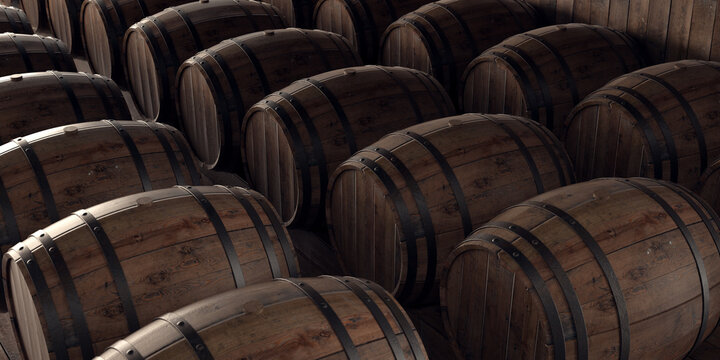 Wine cellar full of oak barrels.