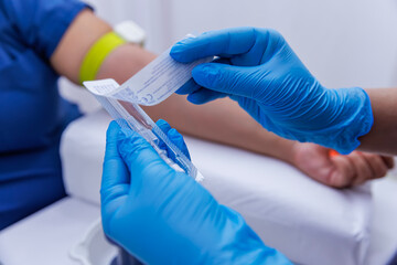 A patient with serum administered in the hospital. Serum is given to the patient. The serum that...