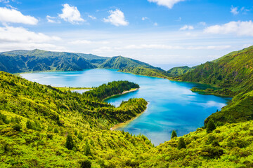 Naklejka premium View of Lagoa do Fogo crater lake in green mountain landscape during summer from famous viewpoint, Sao Miguel island, Azores, Portugal