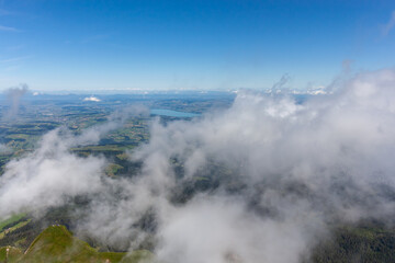 Fototapeta premium Mountain landscape partially in the clouds, view from Pilatus mountain peak, Lucerne