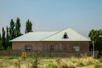 The roof of the house from galvanized metal profile against the sky