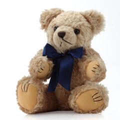 Teddy Bear with a blue bow sitting down