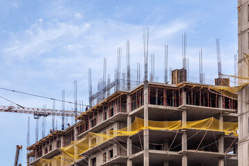 Fototapeta premium construction of modern high-rise residential frame and earthquake-resistant buildings with finishing in Kazakhstan