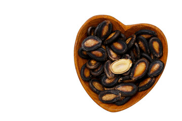 Roasted watermelon seeds on white background.