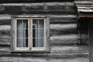 old log cabin house facade with window