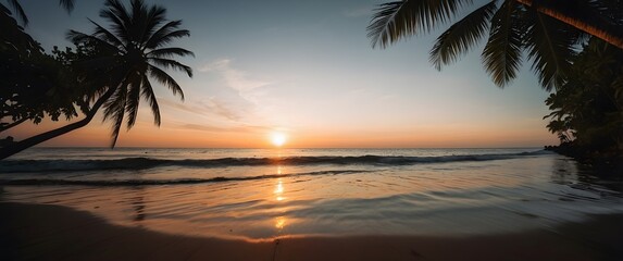 A nostalgic photograph of a tropical sunset, framed by the silhouette of palm leaves. The setting sun casts a warm, orange glow across the sky and the calm ocean water, 