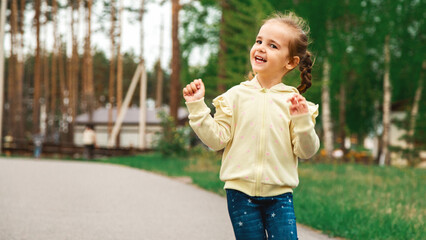 Childhood. Child run on path in spring or summer park. Childhood activity, leisure, lifestyle. Energy, growth, youth concept.