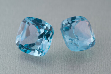 natural blue topaz gem on the isolated white background