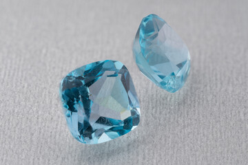 natural blue topaz gem on the isolated white background