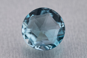 natural blue topaz gem on the isolated white background