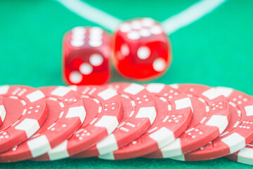 Casino background. Roulette table Chips. Casino theme. High contrast image of casino roulette, poker game, dice game, poker chips on a gaming table