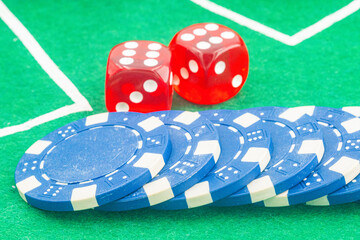 Casino background. Roulette table Chips. Casino theme. High contrast image of casino roulette, poker game, dice game, poker chips on a gaming table