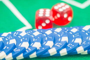 Casino background. Roulette table Chips. Casino theme. High contrast image of casino roulette, poker game, dice game, poker chips on a gaming table