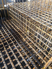 Steel Reinforcement Bars Arranged for Concrete Structure. Construction Site Reinforcement with Rebar Grid Pattern. Structural Engineering and Foundation Concept.