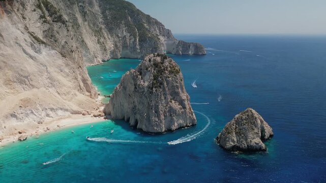 The drone aerial footage of Mizithres beach, Zakynthos Island, Greece. The two conical huge rocks, that bounce from the crystal blue waters in Keri, are called the Small and Big Mitzithra.