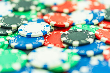 Poker Table With Poker Chips Turns In Casino. Many Poker Chips Spins on the Table in Darkness.