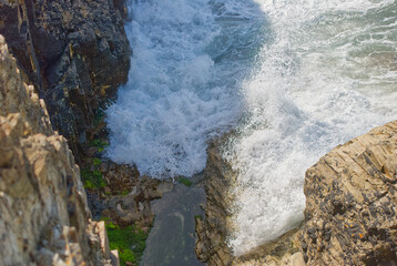 Rocky Cliff Cave Entrance With Waves Perranporth