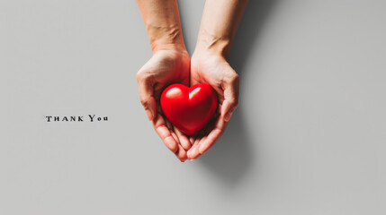Fototapeta premium Thank You Hands Holding Red Heart