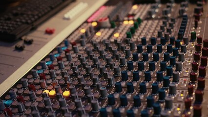 Sound designer manipulating sound effects to enhance tunes on audio recordings, processing and...
