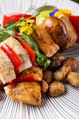 Grilled Chicken with Roasted Potatoes and Herb Salad on Elegant Plate