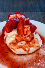 Sweet french dessert, Red strawberry fruit pavlova served in restaurant in Saint-Tropez, France