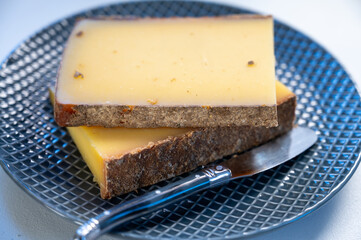 French cheese Comte, varieties unpasteurised ed milk Prestige, fruity flavoured Fruite and Vieille Reserve close up