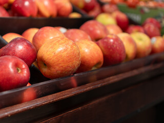 Close-up image of organic apples displayed at a supermarket.