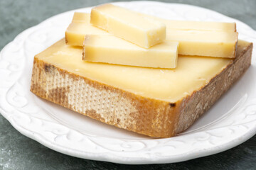 French cheese Comte, varieties unpasteurised ed milk Prestige, fruity flavoured Fruite and Vieille Reserve close up