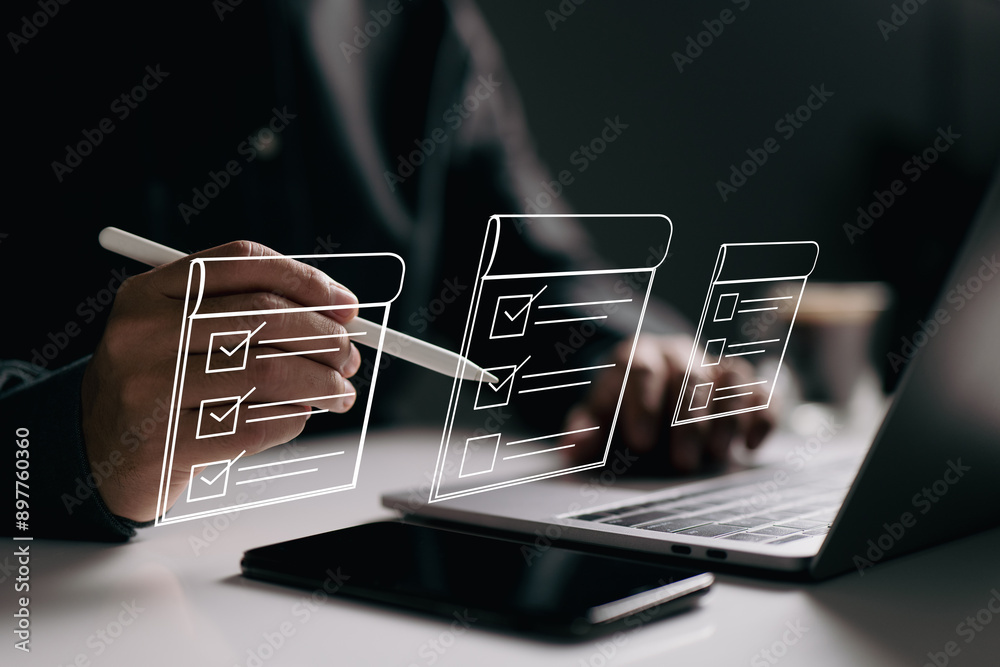 Poster person using a stylus on a laptop with checklists floating in the air. It represents task management, organization, and the use of digital tools to track and complete tasks efficiently and effectively