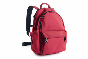 Fototapeta premium Red backpack with zippered pockets on white background suitable for school, travel, back to school concept