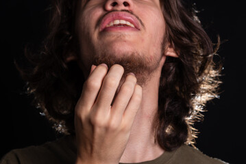 Man scratching his neck with his hand. Skin disease. Irritation, allergy.