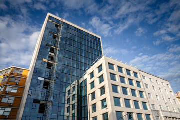 Modern Business High Rise Building Under Construction in Belgrade with a blue sky, in the center business district, with real estate opportunities around;