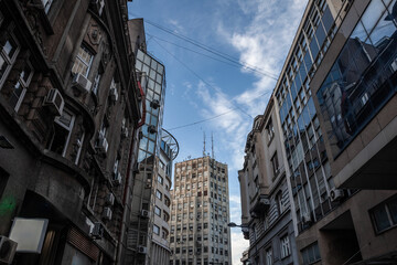 Fototapeta premium Palace Albanija (Palata Albanija) in center of Belgrade seen from pedestrian street of Sremska Ulica. Opened in 1939, This building is an architectural landmark of Terazije district & belgrade center.