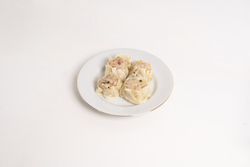 chicken and beef dimsum served on white plate and white background, unique food from china