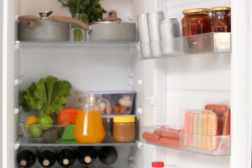Open fridge full of fresh food. Closeup