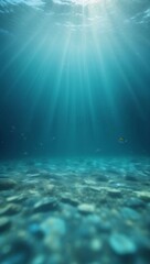 Sunlight beams through blue ocean water with a rocky bottom, out of focus