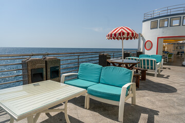 Oceanfront Oasis: Chairs and Umbrella on a Sunny Day