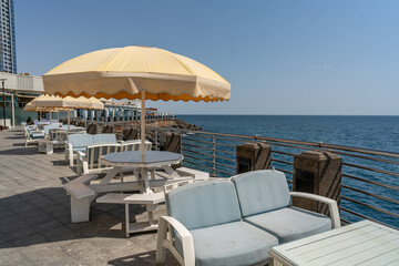 Oceanfront Oasis: Chairs and Umbrella on a Sunny Day