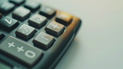 Fototapeta premium Calculator sits on a desk, indicating financial computations being done by an accountant or office employee