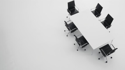 Aerial view of a spacious conference room with a white table and sleek black leather chairs