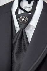 groom suit decorated with accessories,