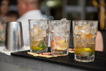 preparing a cocktail with ice and fruit  at the wedding